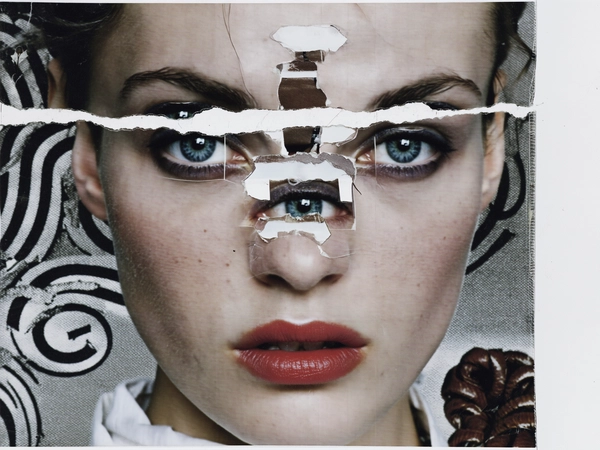 Her face is dissected into overlapping layers—icy blue eyes are repeated thrice, one set inverted and shifted toward the temple, another floating near the jawline. Her mouth is split diagonally, the upper lip displaced upward and doubled in translucent print. The nose bridge fractures into two separate strips, one pasted askew beneath her cheek, creating an unsettling, disjointed symmetry. Jagged torn paper edges and masking tape fragments hold each facial element in place, building a tactile construction reminiscent of punk-era photocopy collage.

Her skin bears matte whiteness with visible pores and faint freckles, echoing the soft texture of a worn newsprint. The matte white fabric of her dress blends into a grainy xerox background peppered with halftone spirals, mirroring the coiled leather belt motif. Scratched ink marks and ripped paper seams frame the composition, emphasizing the handmade analog aesthetic.