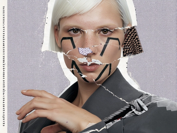 Her face is sharply fragmented with geometric face paint shapes—triangular patches duplicated and shifted around her cheekbones, a pair of eyes overlapped unevenly with one rotated 45 degrees, and a mouth section torn and repositioned just beneath the jawline. The nose bridge is sliced by a diagonal paper seam that overlaps her short platinum-blond hair at the edges, while one ear is halftone patterned and partially peeled away like a torn sticker. Tape strips and rough collage borders frame the facial pieces, creating a hand-assembled, disjointed collage effect reminiscent of underground zine cut-ups.

Her pale skin is textured with visible pores and faint freckles beneath the fragmented paint patterns, contrasting against the matte graphite-grey coat whose edges appear rough-cut and taped. Her hand, caught mid-gesture on the exaggerated buckle of a twisted rope belt, is photo-realistic with slight wrinkles and print grain. The background features xerox grain, halftone dots, and torn paper edges layered to heighten analog imperfection, capturing the chaotic tactile energy of DIY fashion zines.